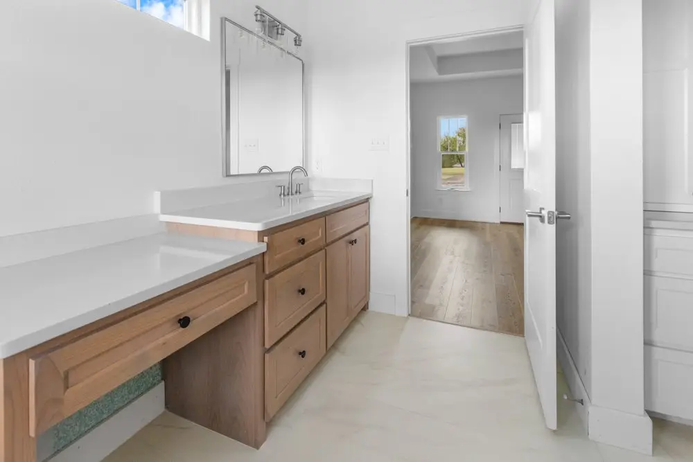 Bathroom vanity looking into the hallway, The Dahl House, a custom home in Sherman, Texas