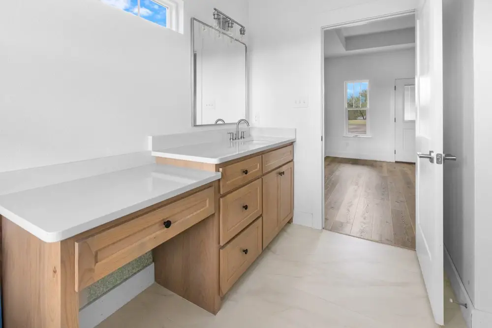 Bathroom vanity with a makeup desk, The Dahl House, a custom home in Sherman, Texas