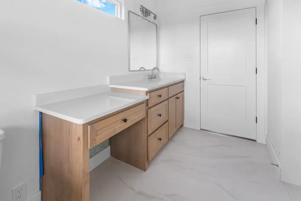Bathroom vanity with a seated makeup station, The Dahl House, a custom home in Sherman, Texas