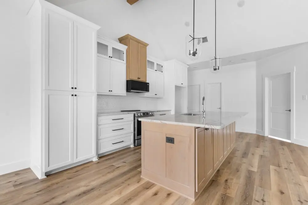 Kitchen with the island and pantry, The Dahl House, a custom home in Sherman, Texas