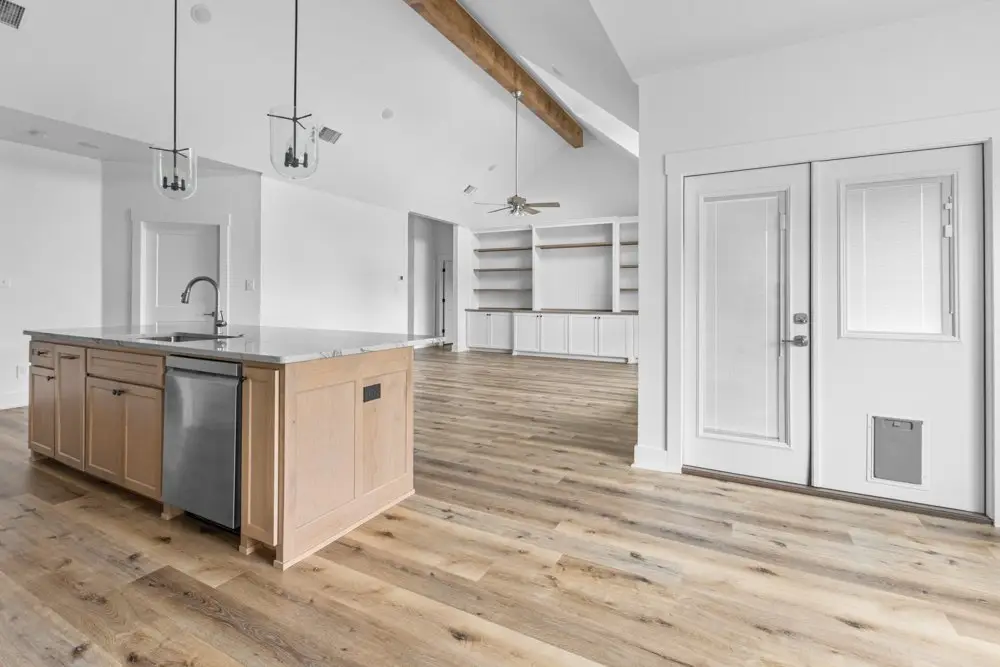 Kitchen island open to the living room, The Dahl House, a custom home in Sherman, Texas