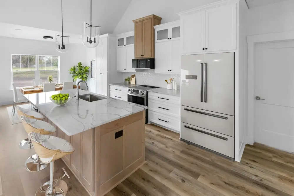 Kitchen with barstools at the island, staged, The Dahl House, a custom home in Sherman, Texas