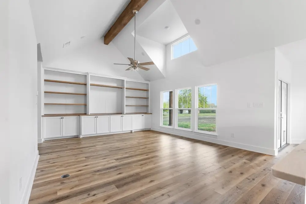 Living room with built-ins under a cathedral ceiling, The Dahl House, a custom home in Sherman, Texas