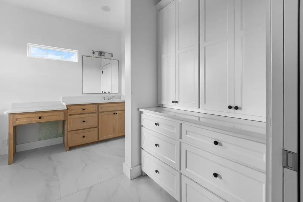 Primary bathroom vanity with linen cabinets, The Dahl House, a custom home in Sherman, Texas