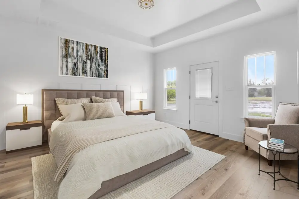 Primary bedroom, staged, under a tray ceiling, The Dahl House, a custom home in Sherman, Texas