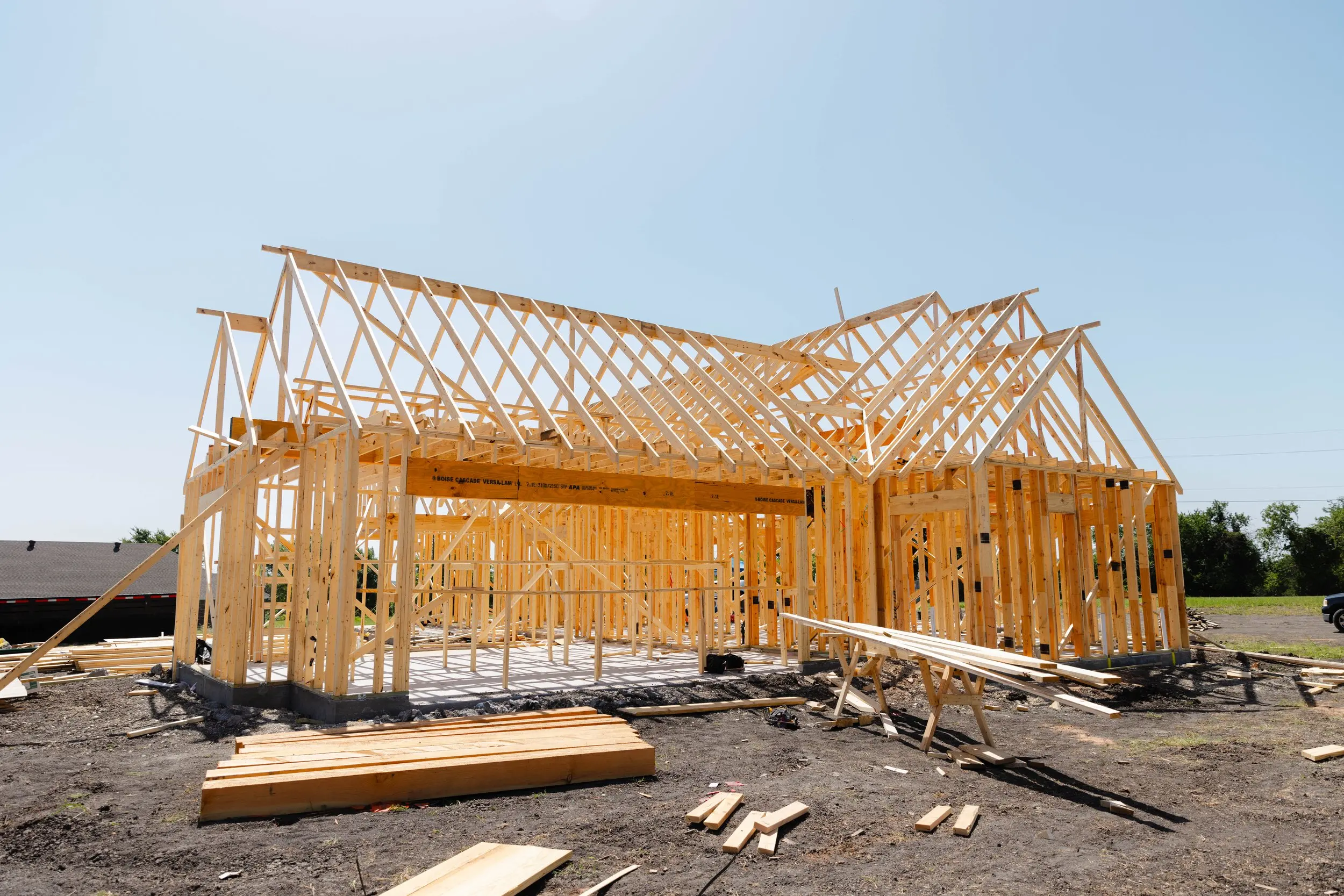 A framed house on its slab during new construction in Grayson County, Texas