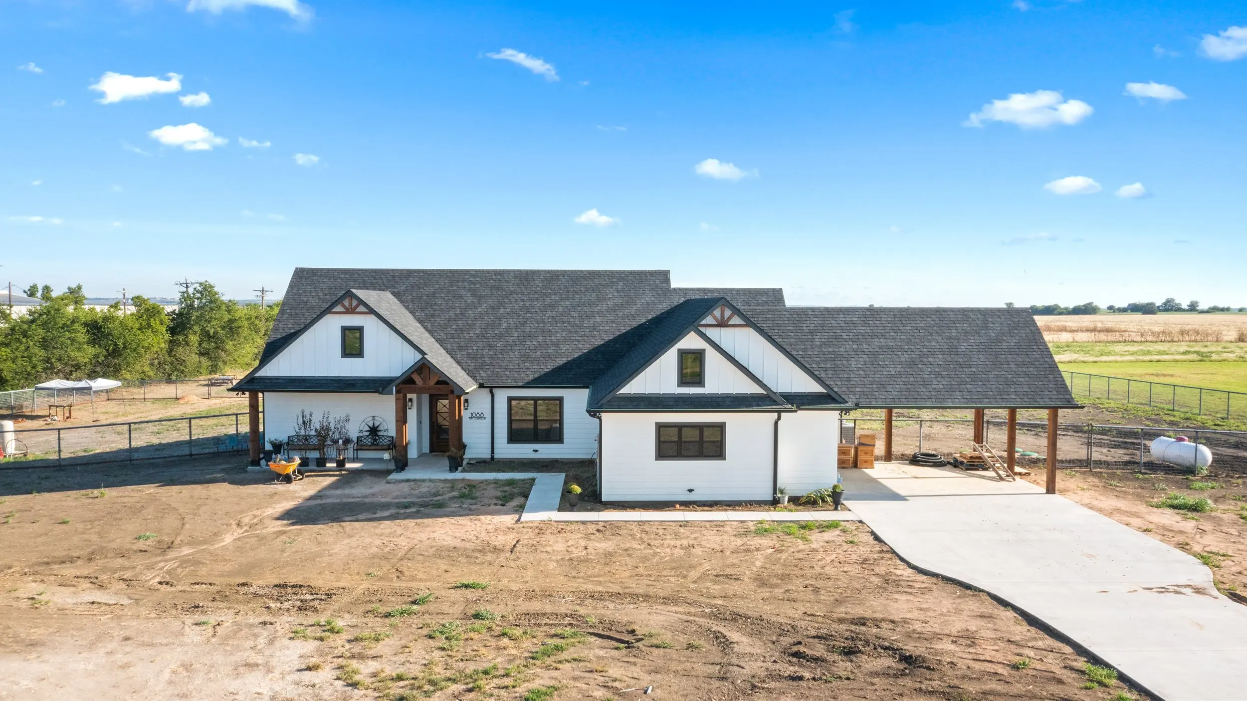 Aerial view of a custom home on acreage near Sherman, Texas