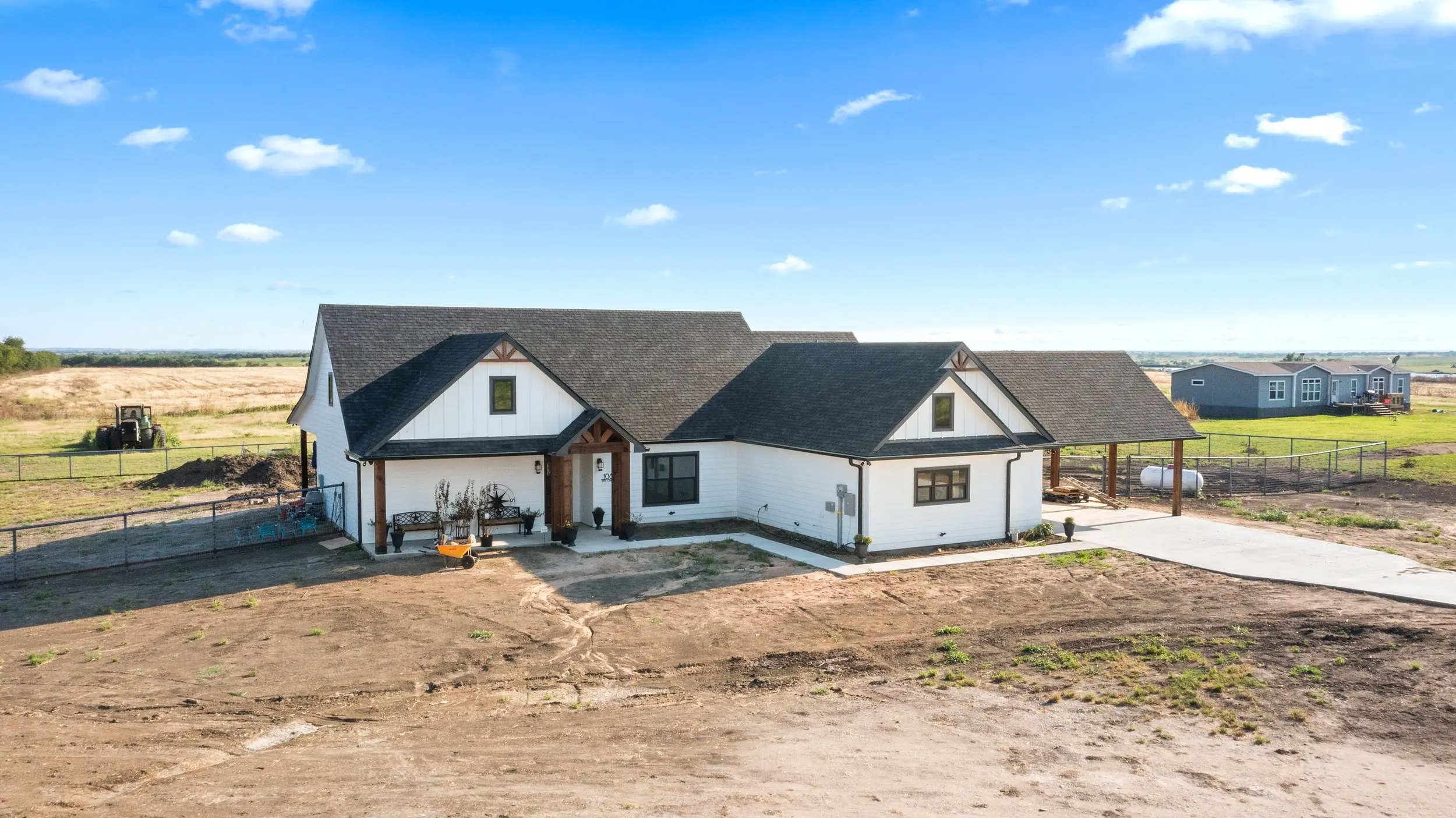Aerial view of the house from the front corner, The Lugo House, a custom home in Sherman, Texas