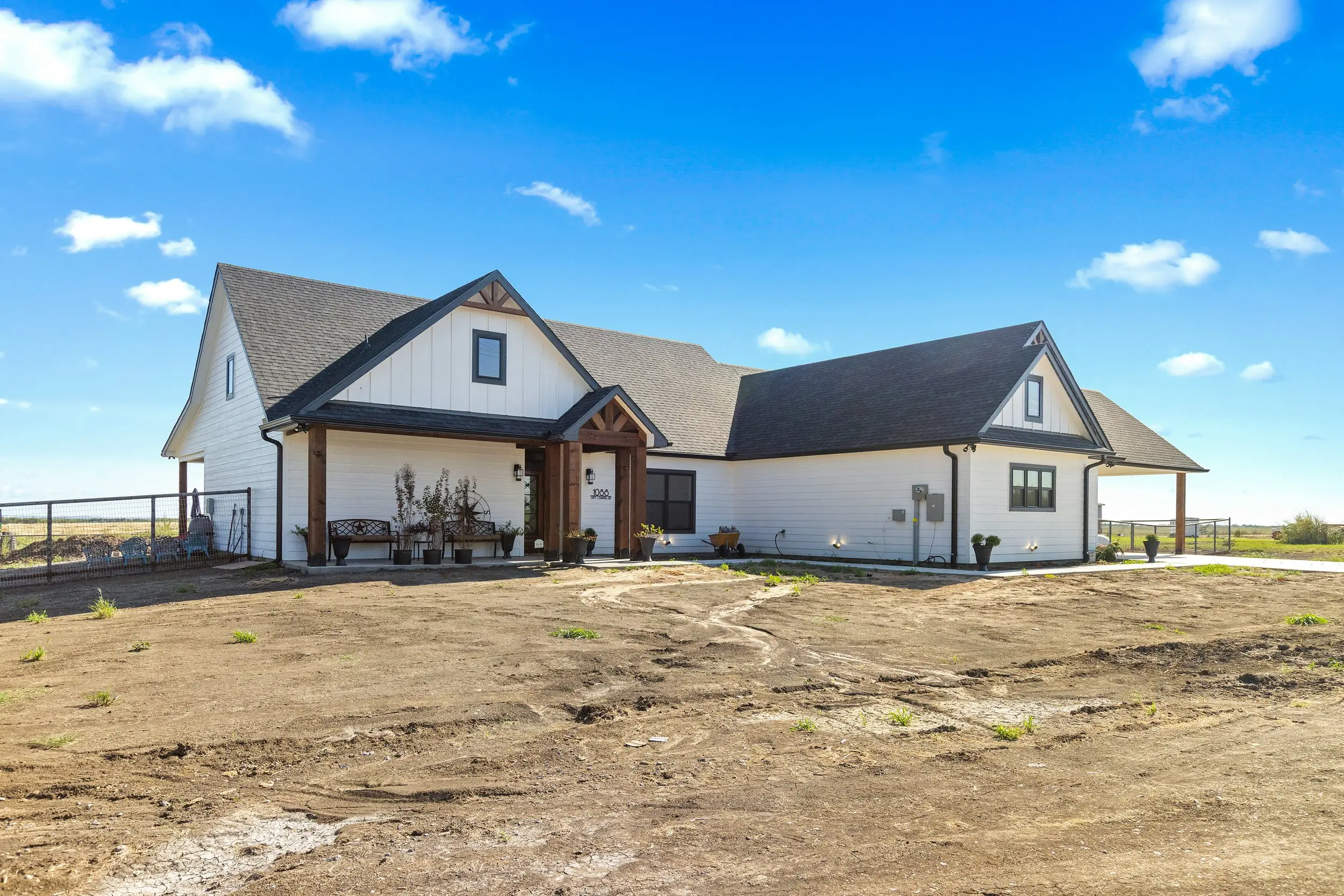 Wide view of the front and side of the house, The Lugo House, a custom home in Sherman, Texas