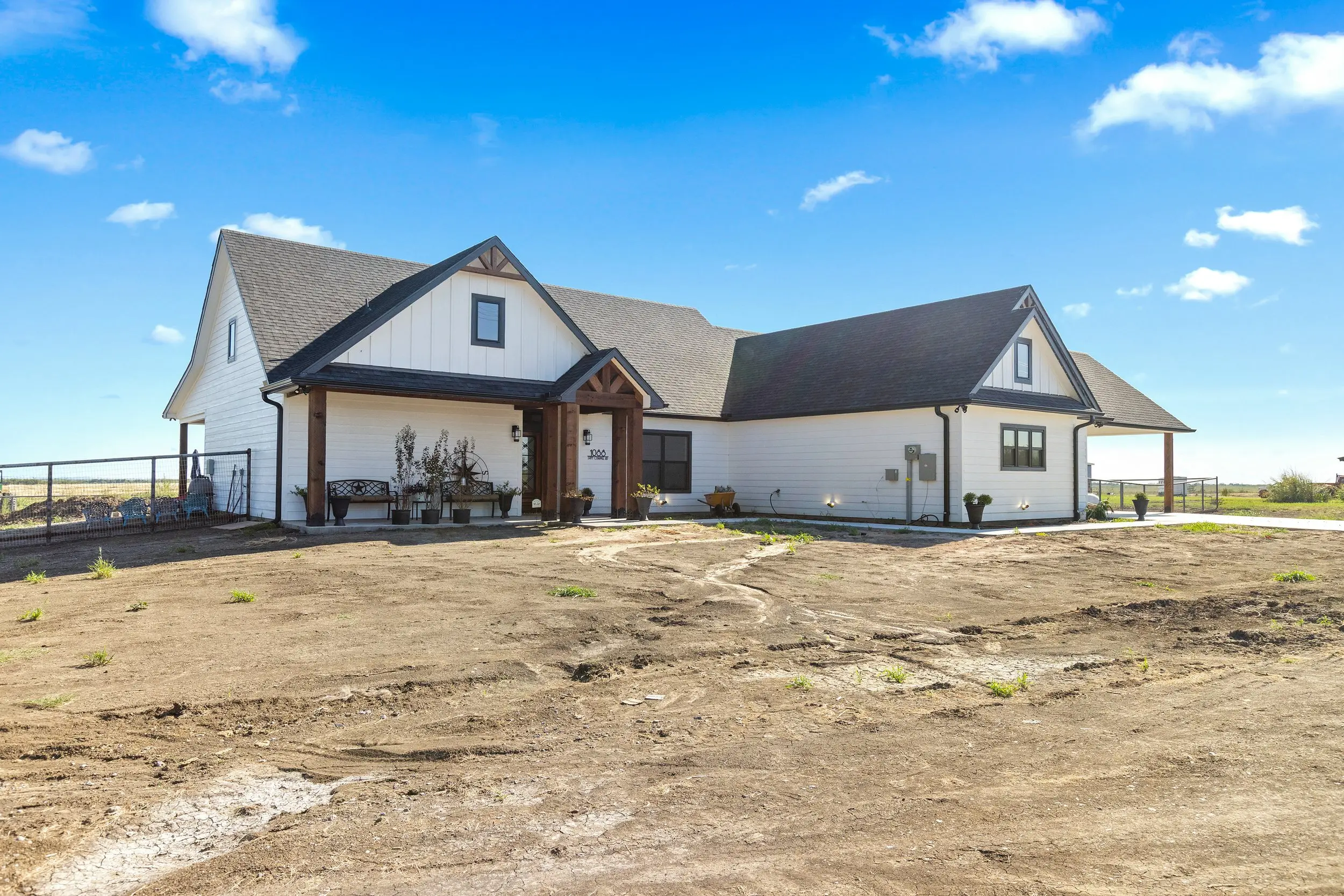 Front of the house with its covered porch, The Lugo House, a custom home in Sherman, Texas
