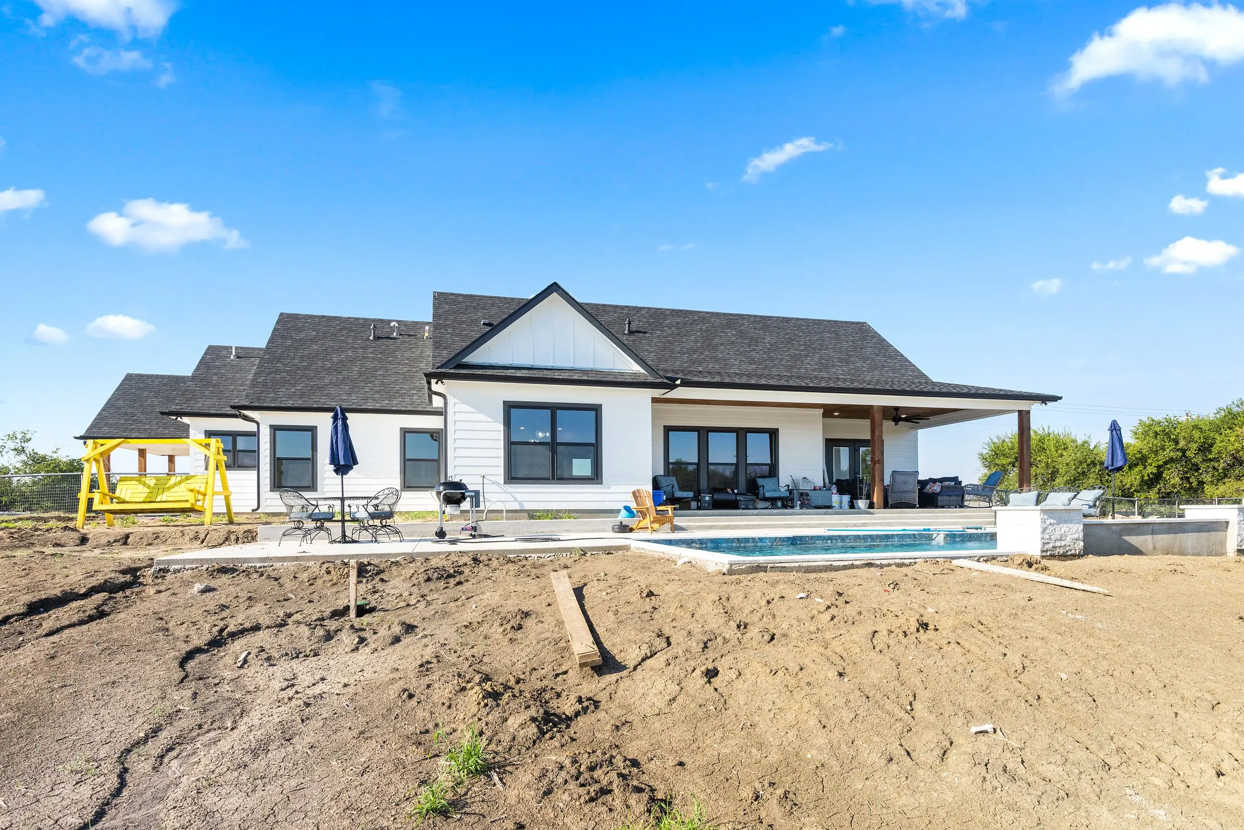 Wide view of the rear of the house and pool, The Lugo House, a custom home in Sherman, Texas