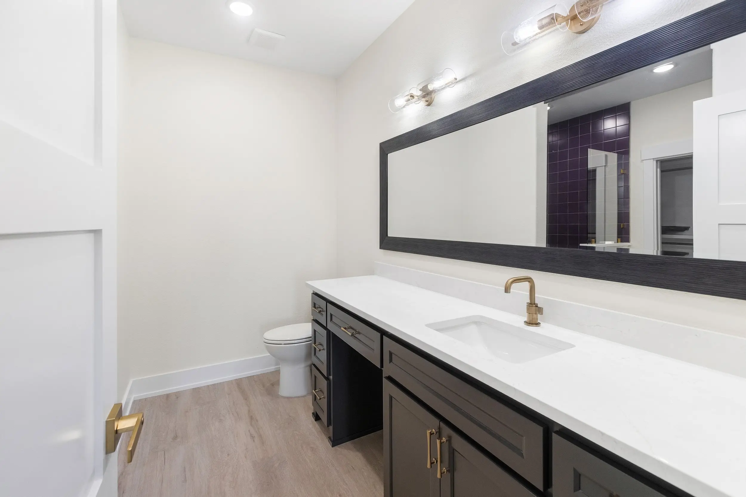 Primary bathroom with a long double vanity, The Lugo House, a custom home in Sherman, Texas