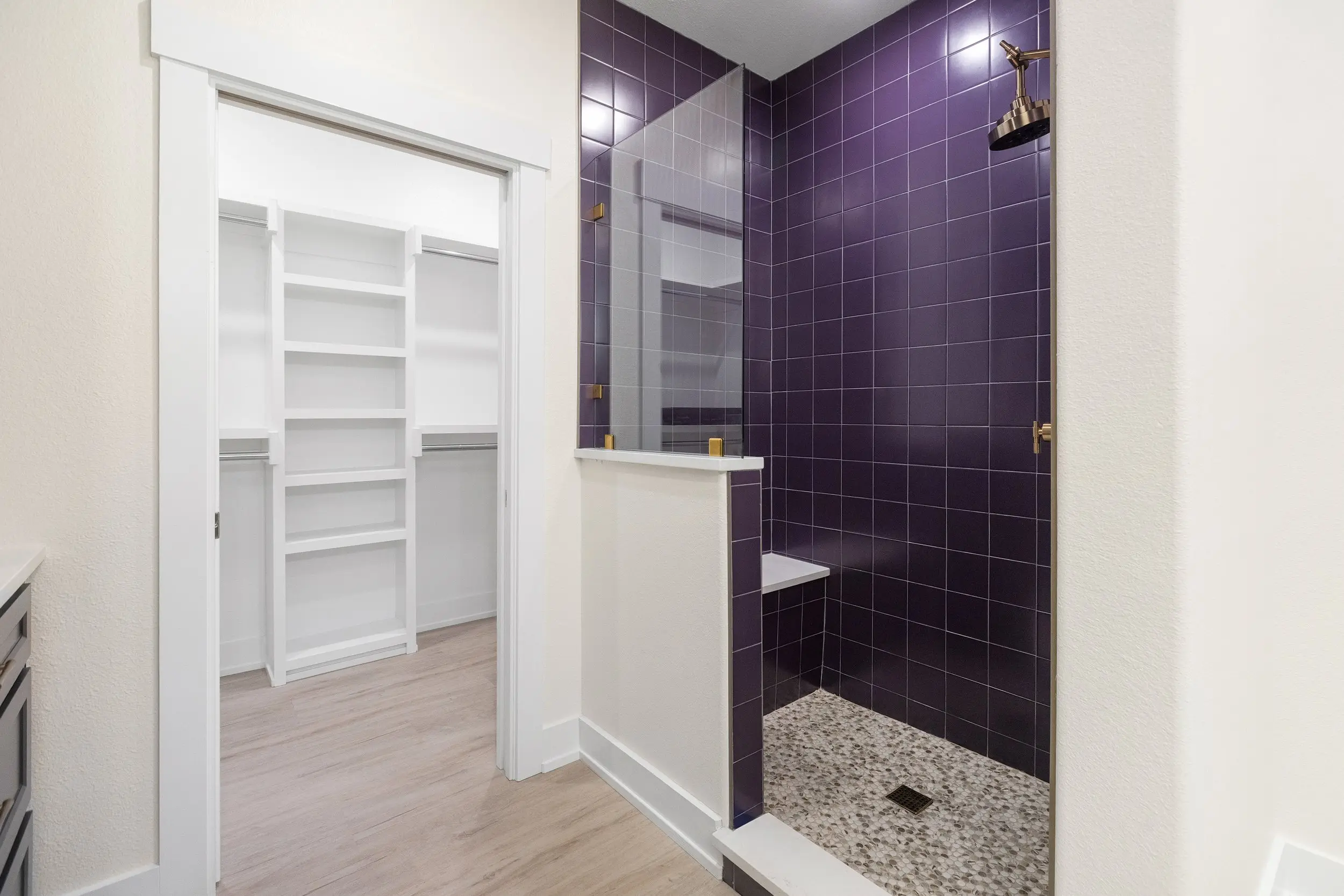 Walk-in closet beside the tiled shower, The Lugo House, a custom home in Sherman, Texas