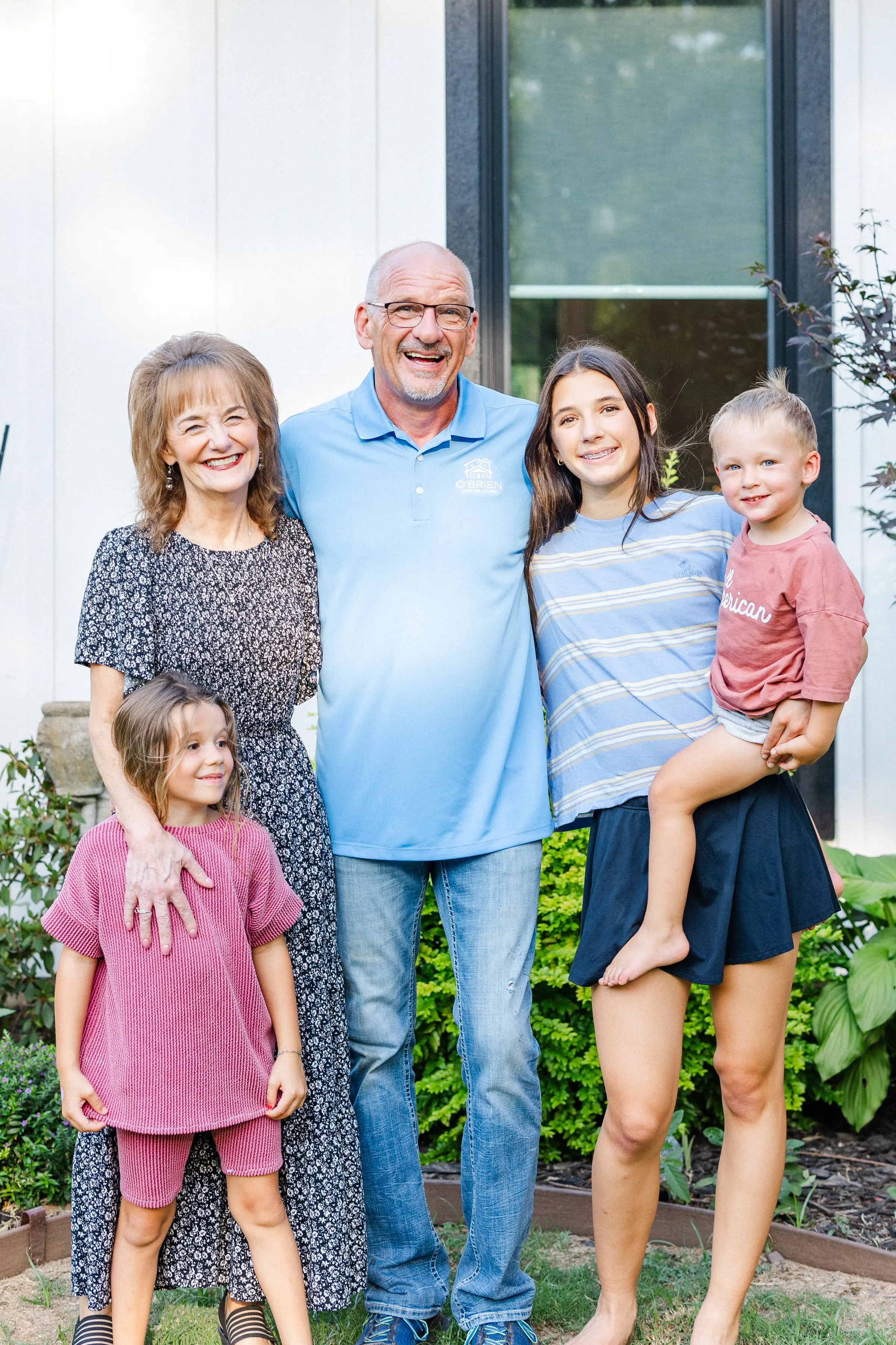 Randy O’Brien with his family outside a home in Grayson County.