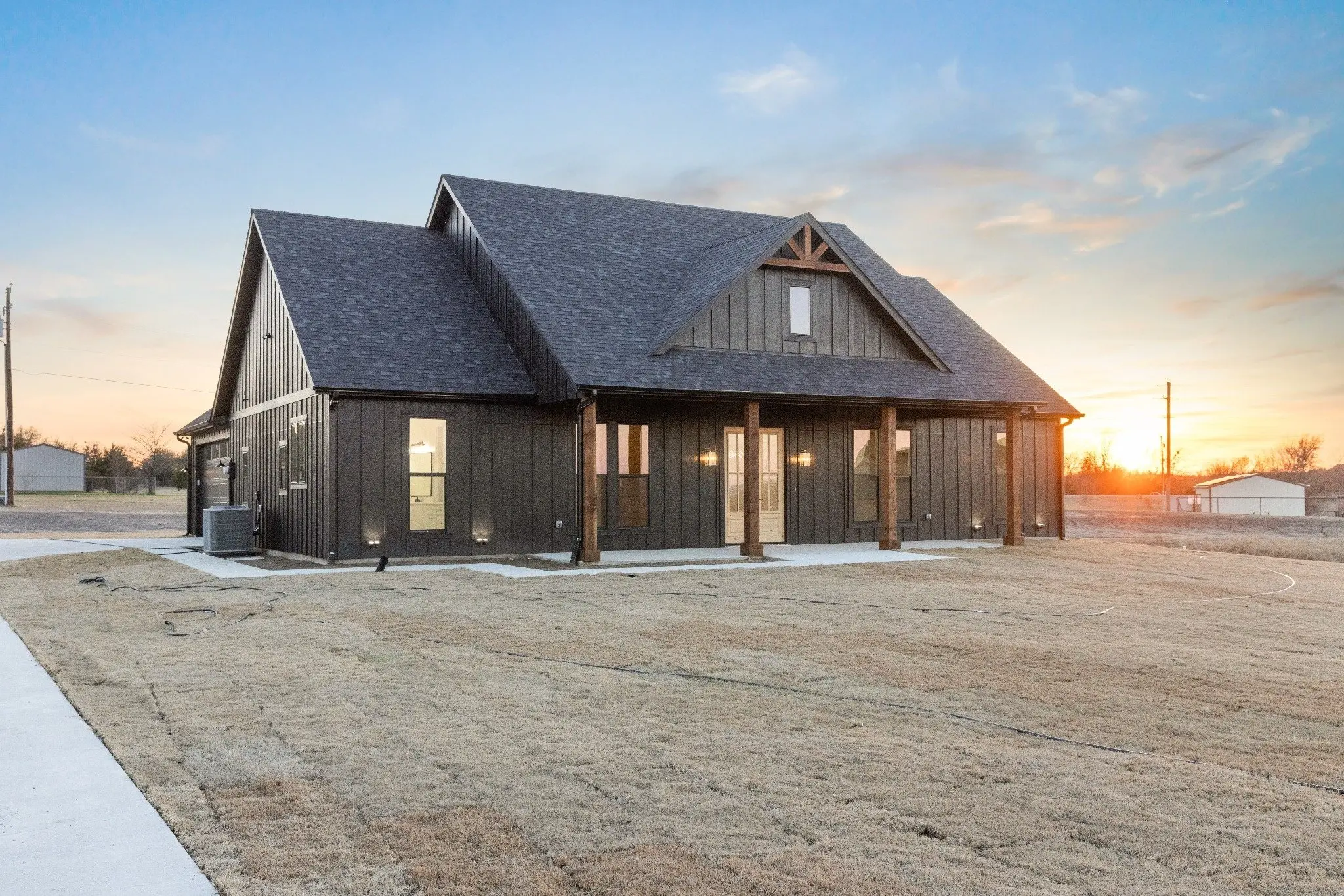Board and batten exterior of a modern farmhouse in Sherman, Texas