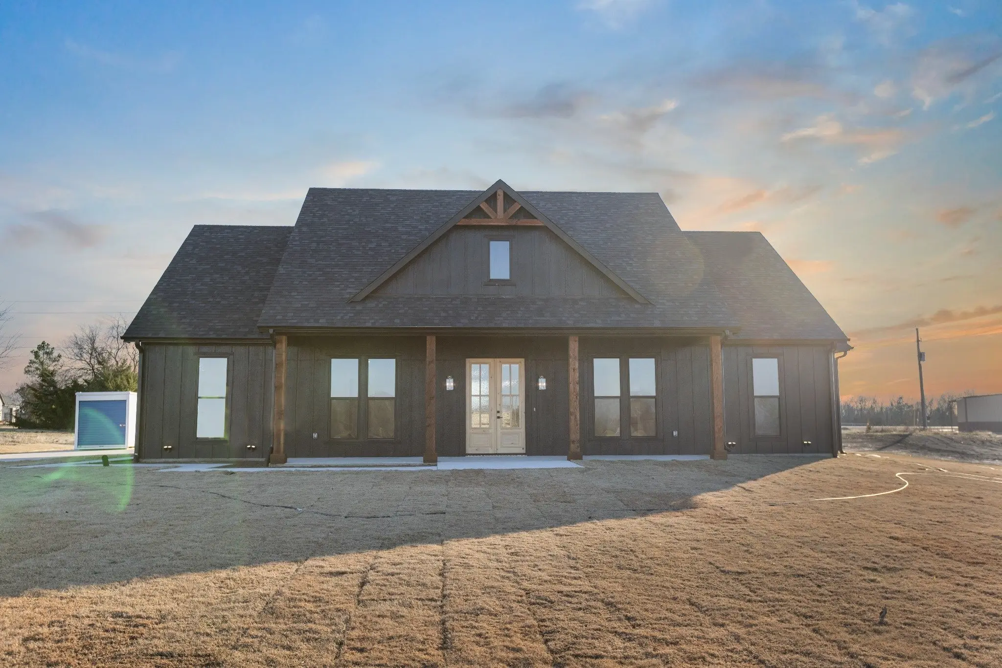 Front elevation at dusk, The Wester House, a custom home in Sherman, Texas