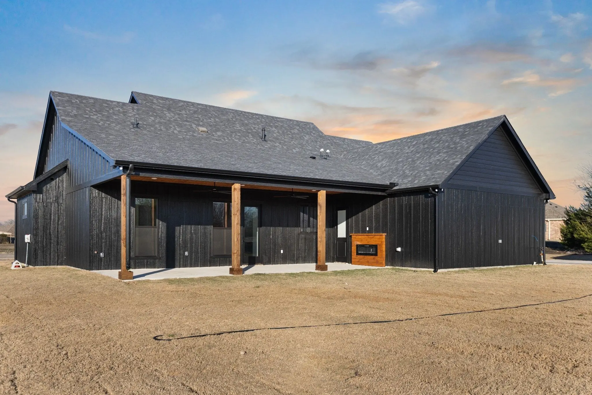 Rear of the house with its covered porch, The Wester House, a custom home in Sherman, Texas