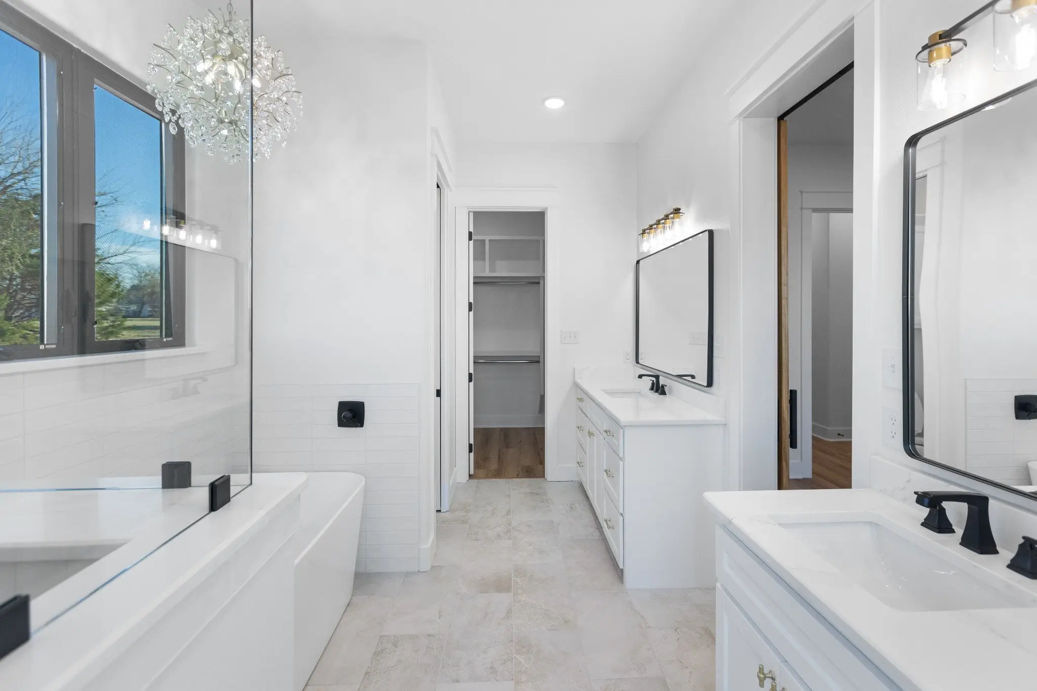 Primary bathroom with a soaking tub and double vanity, The Wester House, a custom home in Sherman, Texas