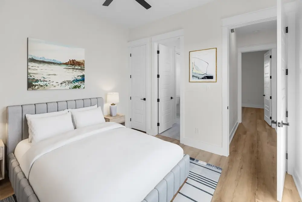 Primary bedroom, staged, with the ensuite beyond, The Wester House, a custom home in Sherman, Texas